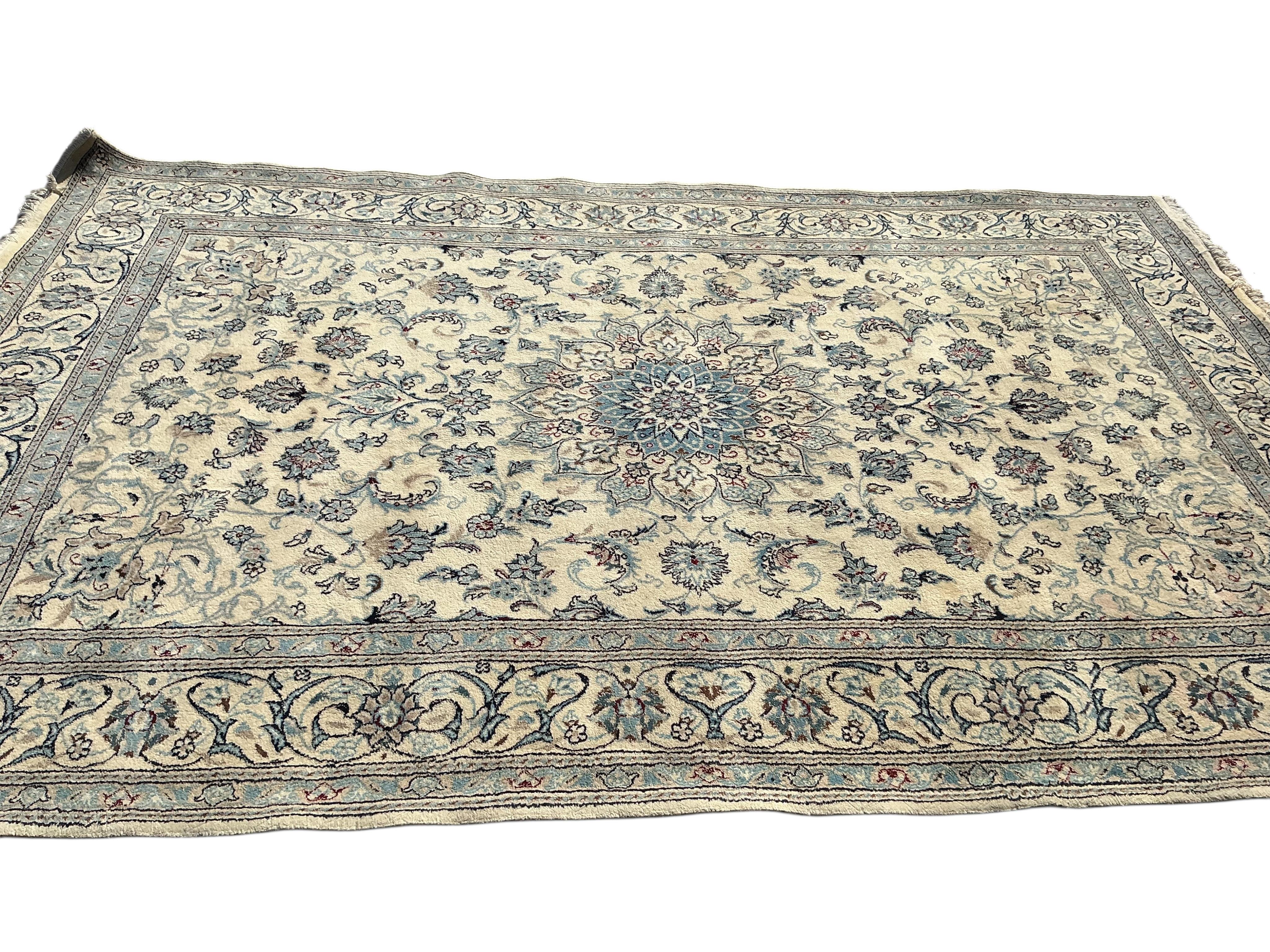 A Tabriz ivory ground carpet, 310 x 195cm